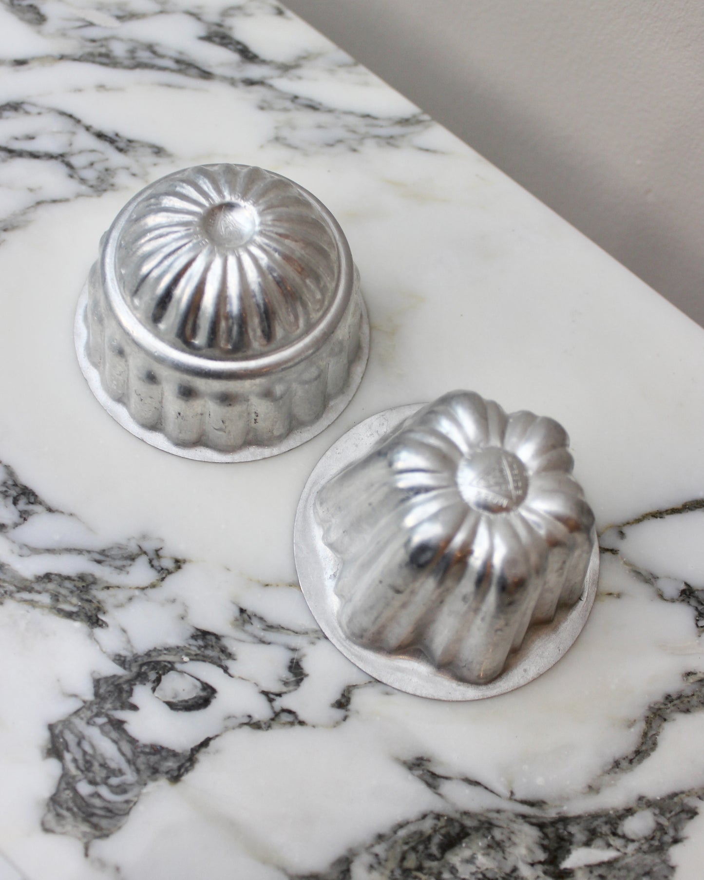 A Pair of Miniature Tin Jelly Moulds