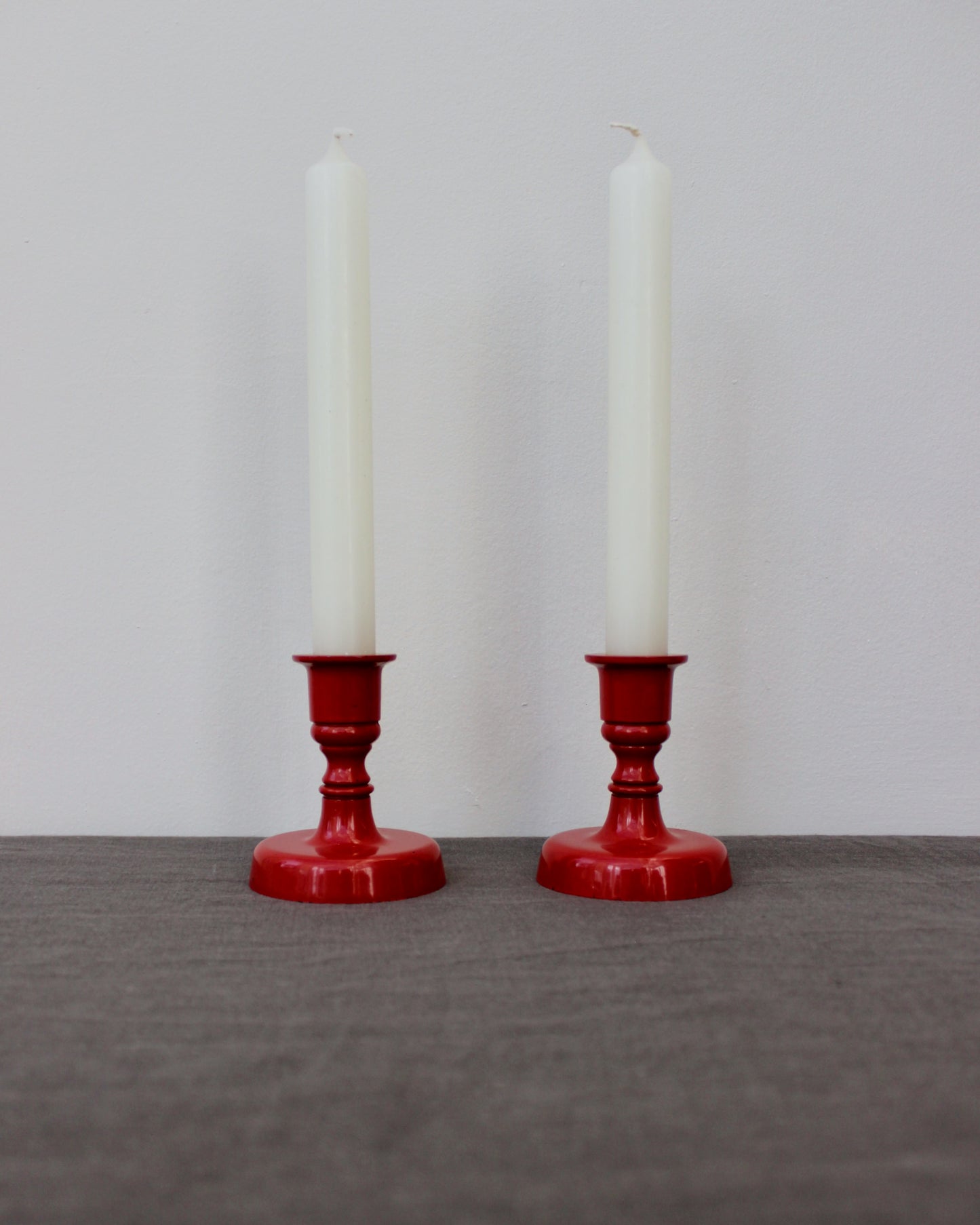 Pair of Red Enamel Candlesticks