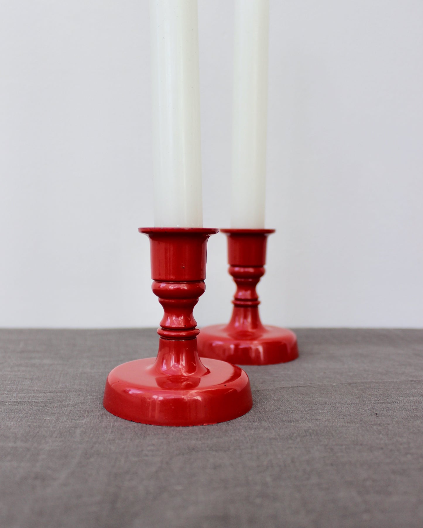 Pair of Red Enamel Candlesticks