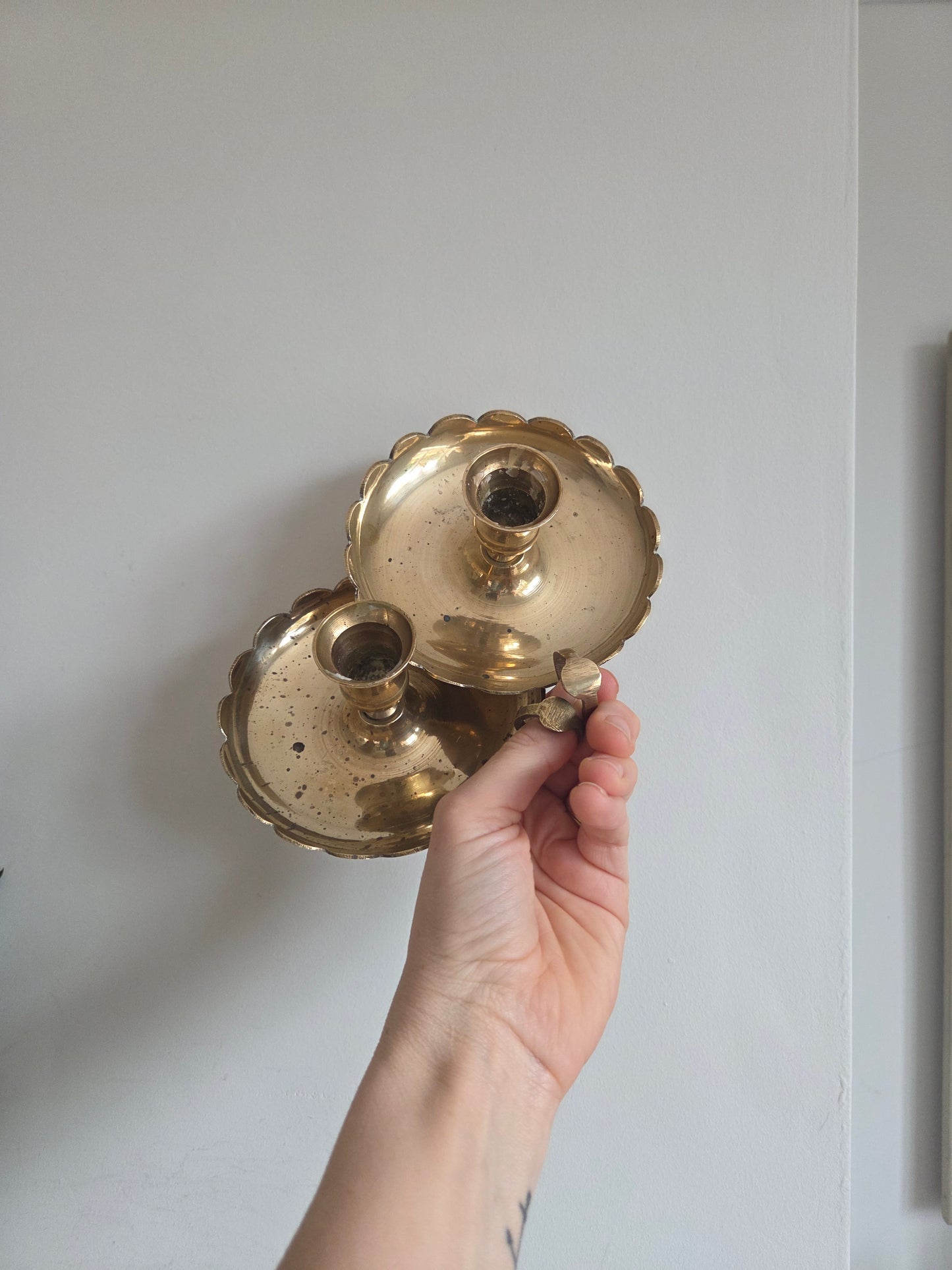 A Pair of Scallop Brass Candlesticks