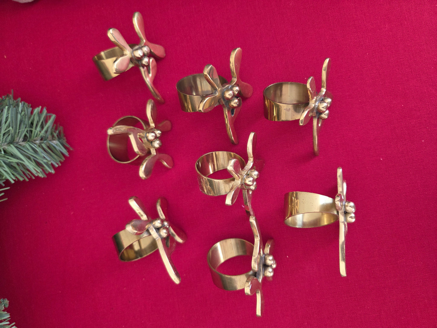 Set of Eight Brass Mistletoe Napkin Rings