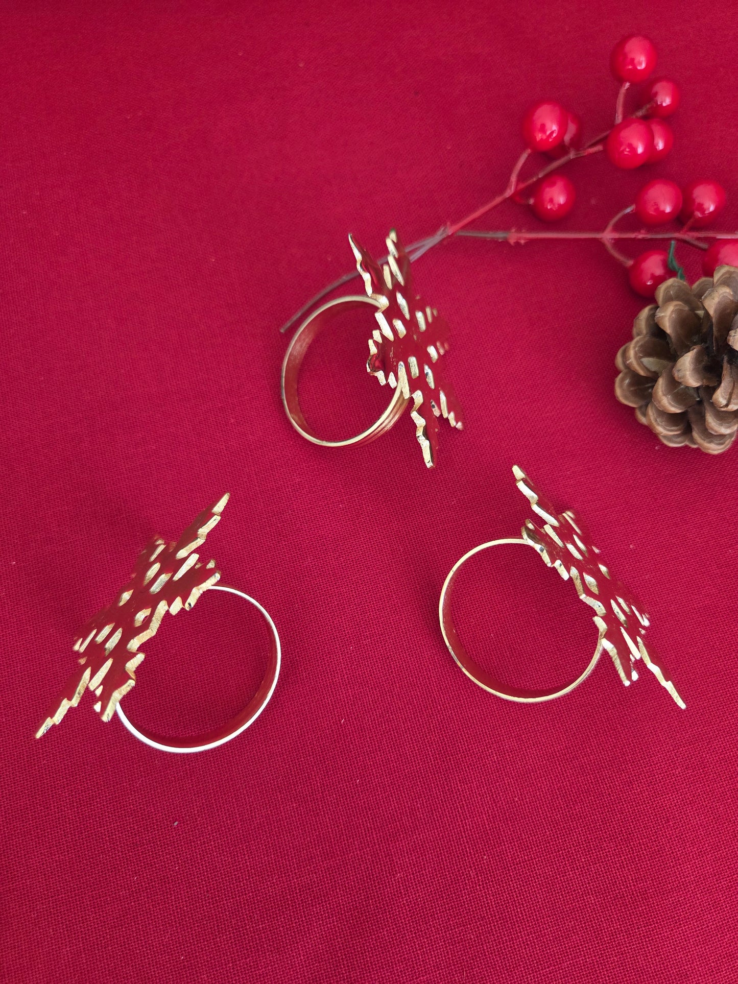 Set of Three Brass Snowflake Napkin Rings