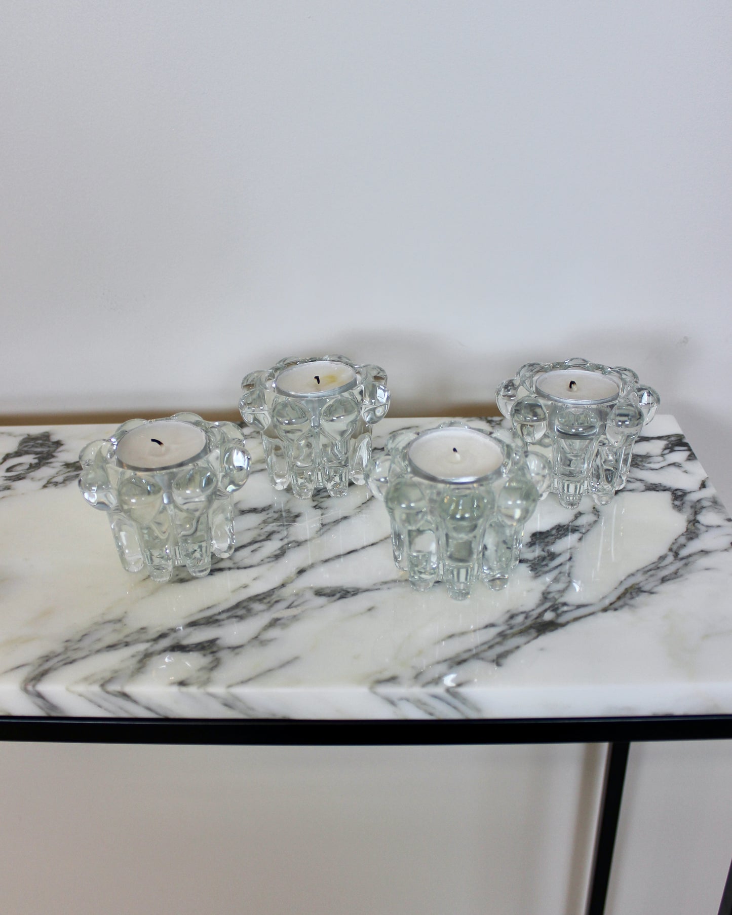 A Set of 4 Glass Candle Holders