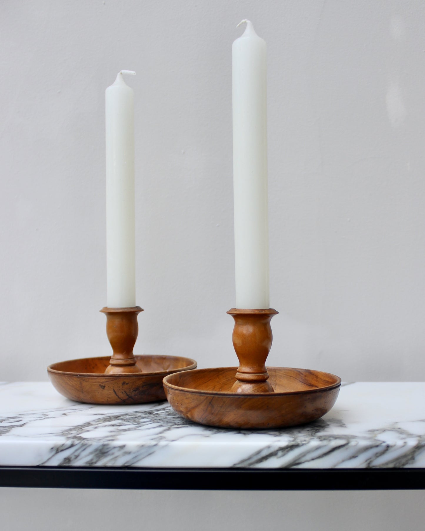 A Pair of Wood Turned Candlesticks