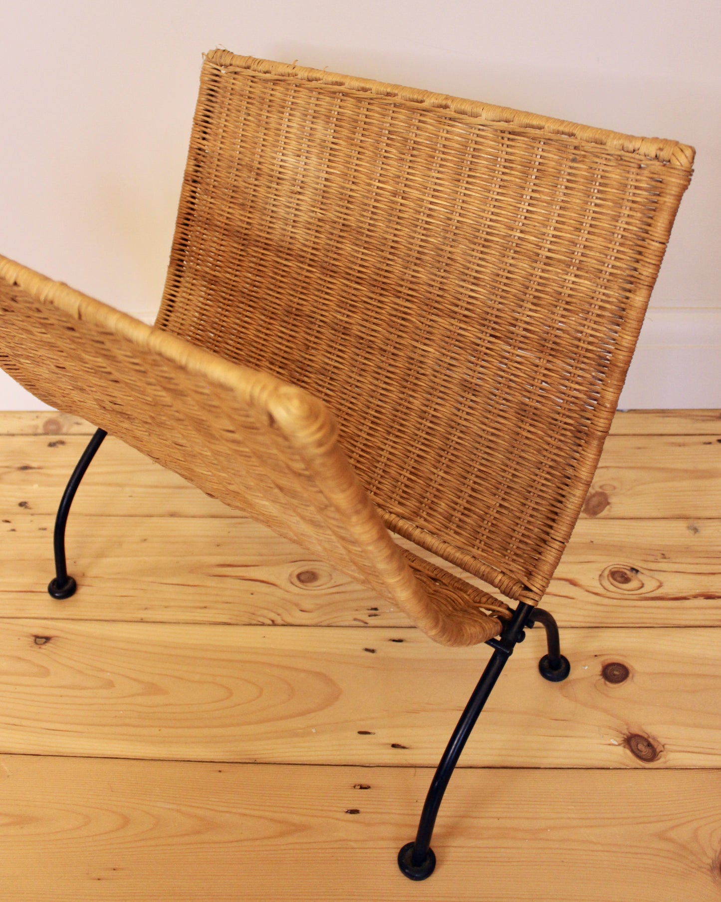 Wicker Woven and Cast Iron Magazine rack