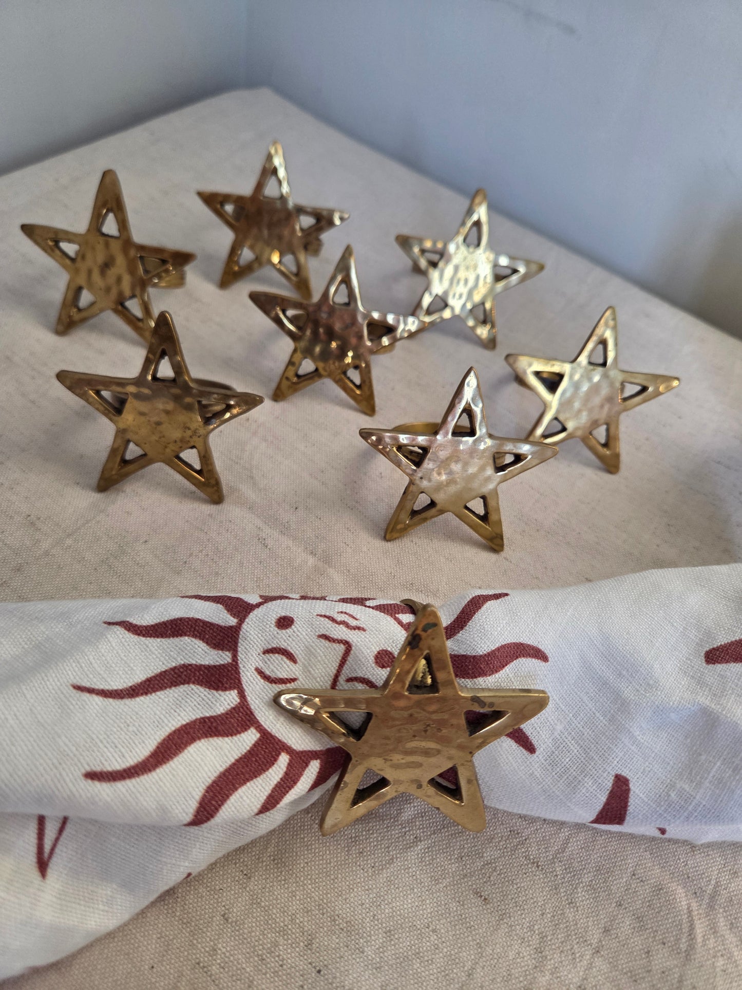 Set of Eight Brass Star Napkin Rings