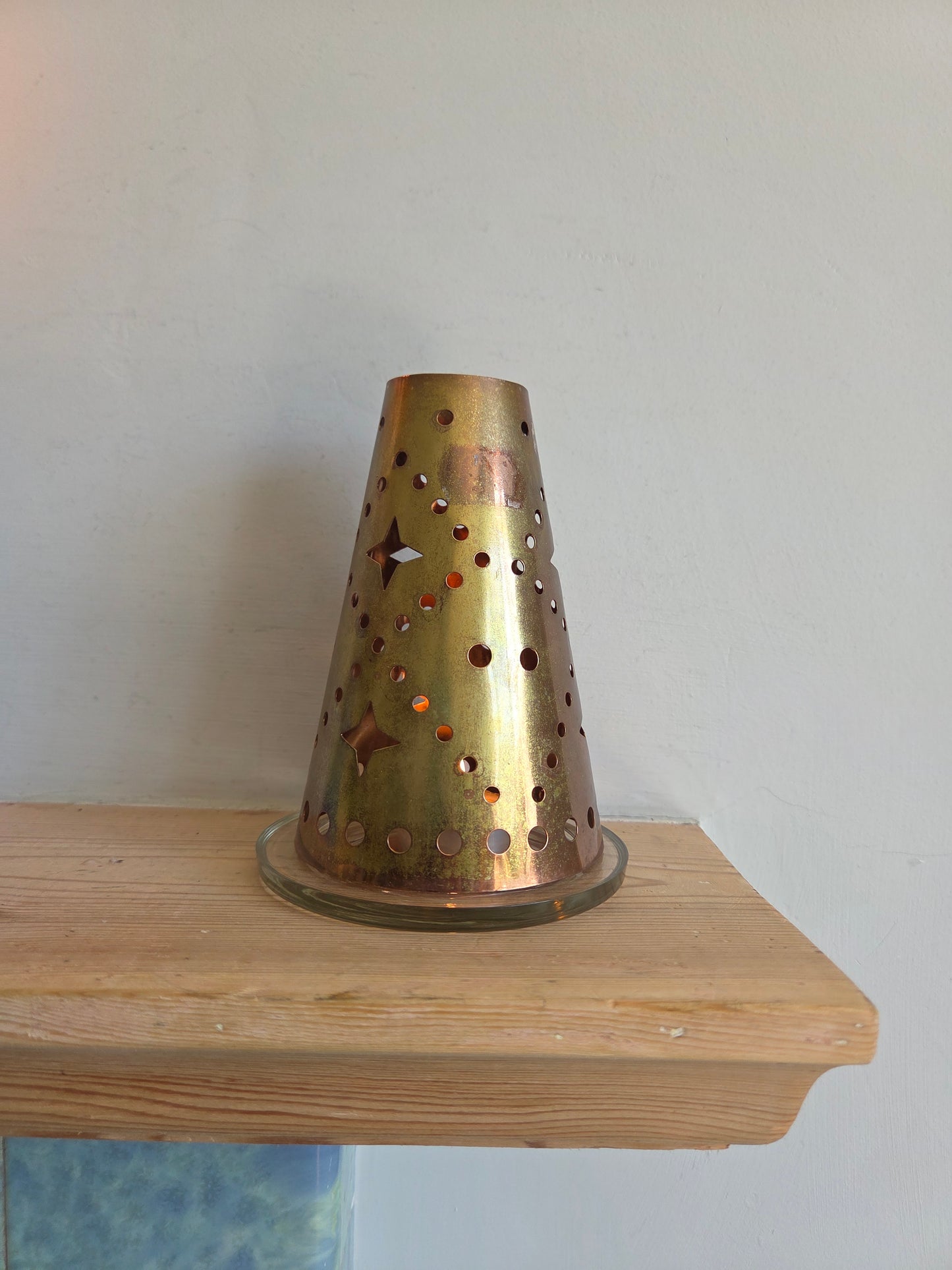 Brass Coloured Tealight Shade with Star Cutouts on Glass Candle Plate