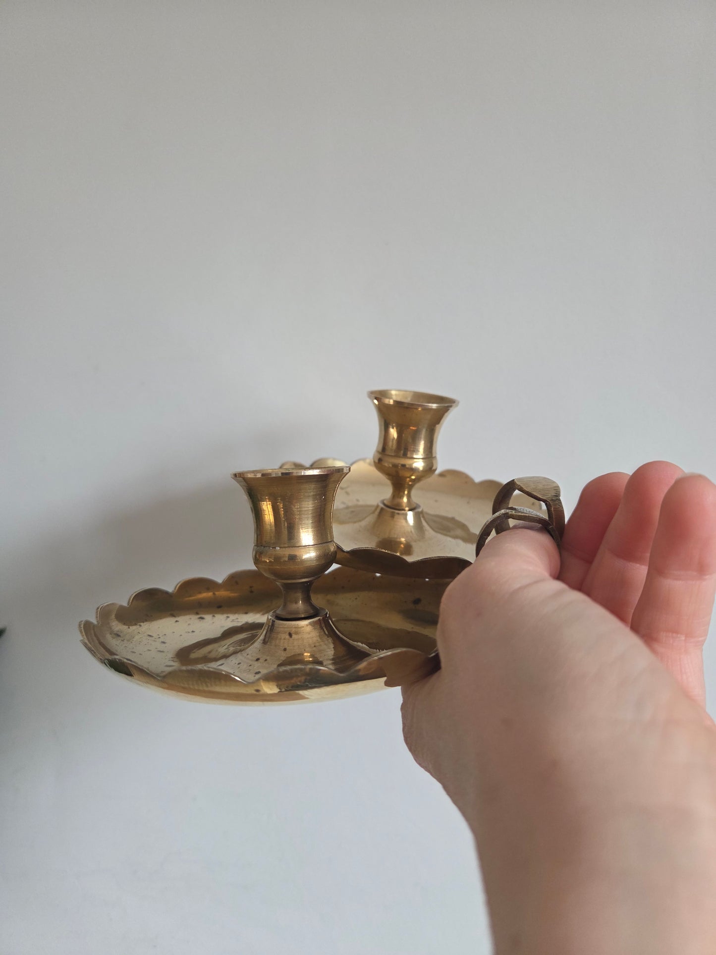 A Pair of Scallop Brass Candlesticks