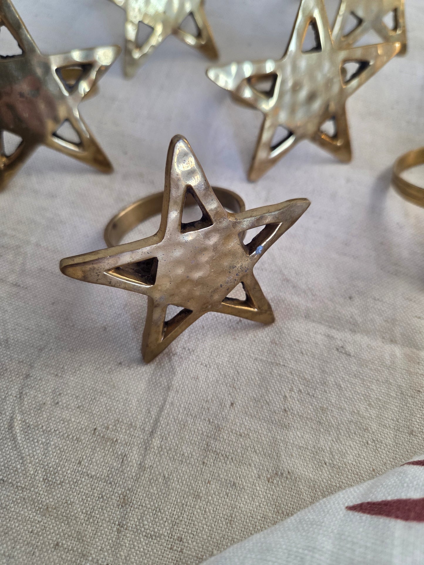 Set of Eight Brass Star Napkin Rings