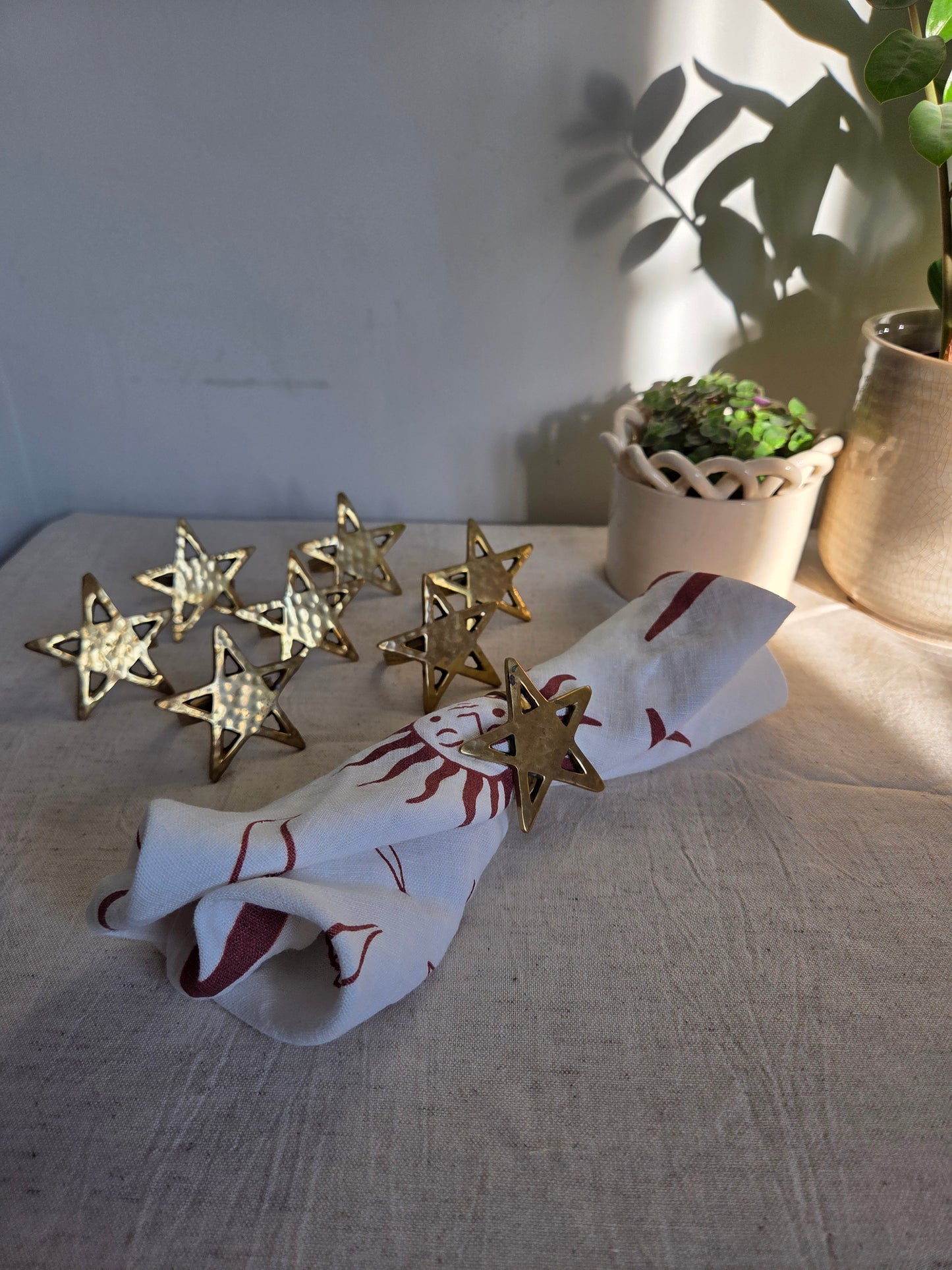 Set of Eight Brass Star Napkin Rings