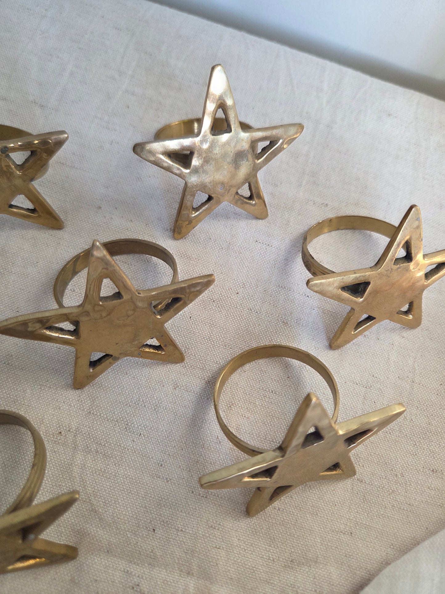 Set of Eight Brass Star Napkin Rings