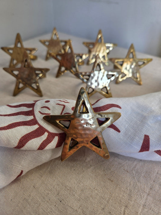 Set of Eight Brass Star Napkin Rings