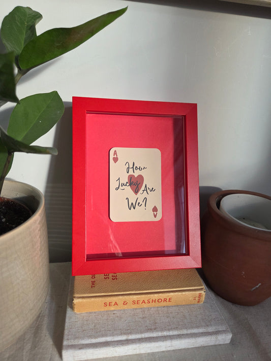 FRAMED How Lucky Are We? Playing Card Art Print - Small Red Frame